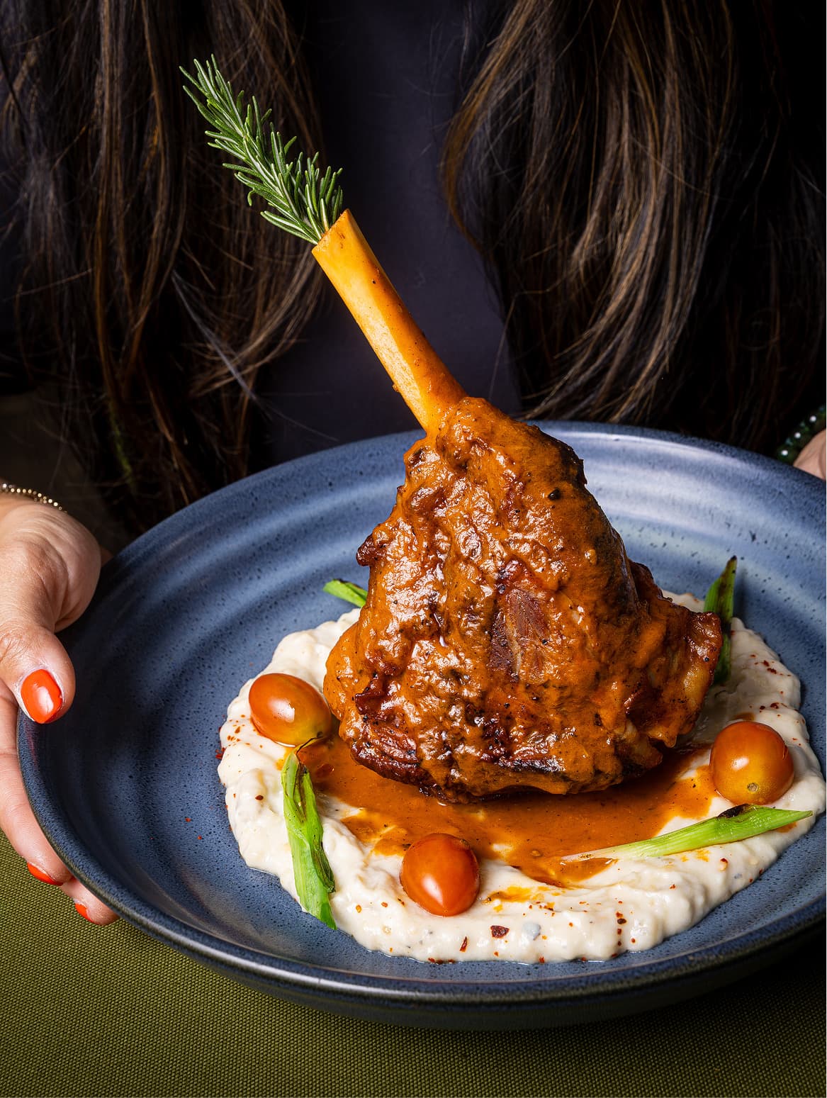 Lamb shank on blue plate
